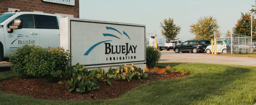 Blue Jay Irrigation Head Office sign with work truck in front